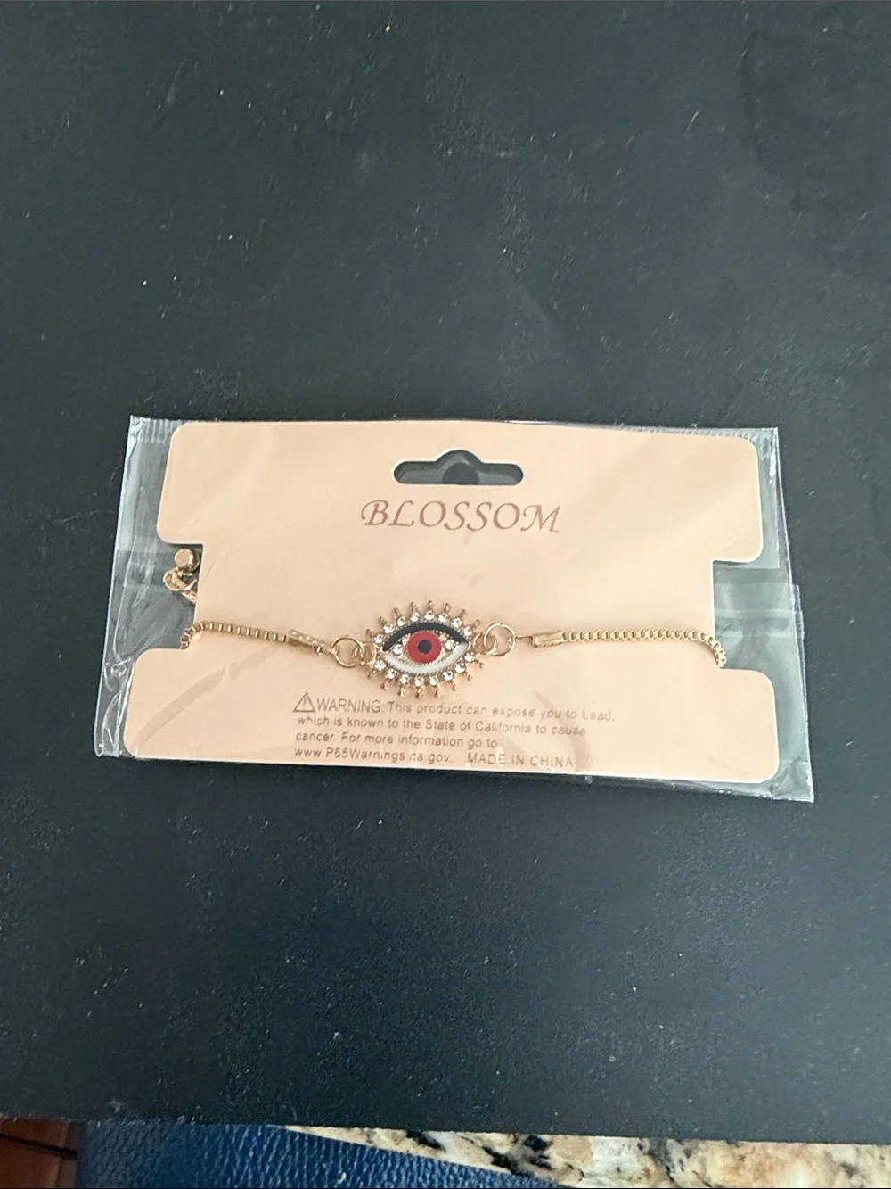 NWOT Blossom Gold Evil Eye Bracelet with Red Accent